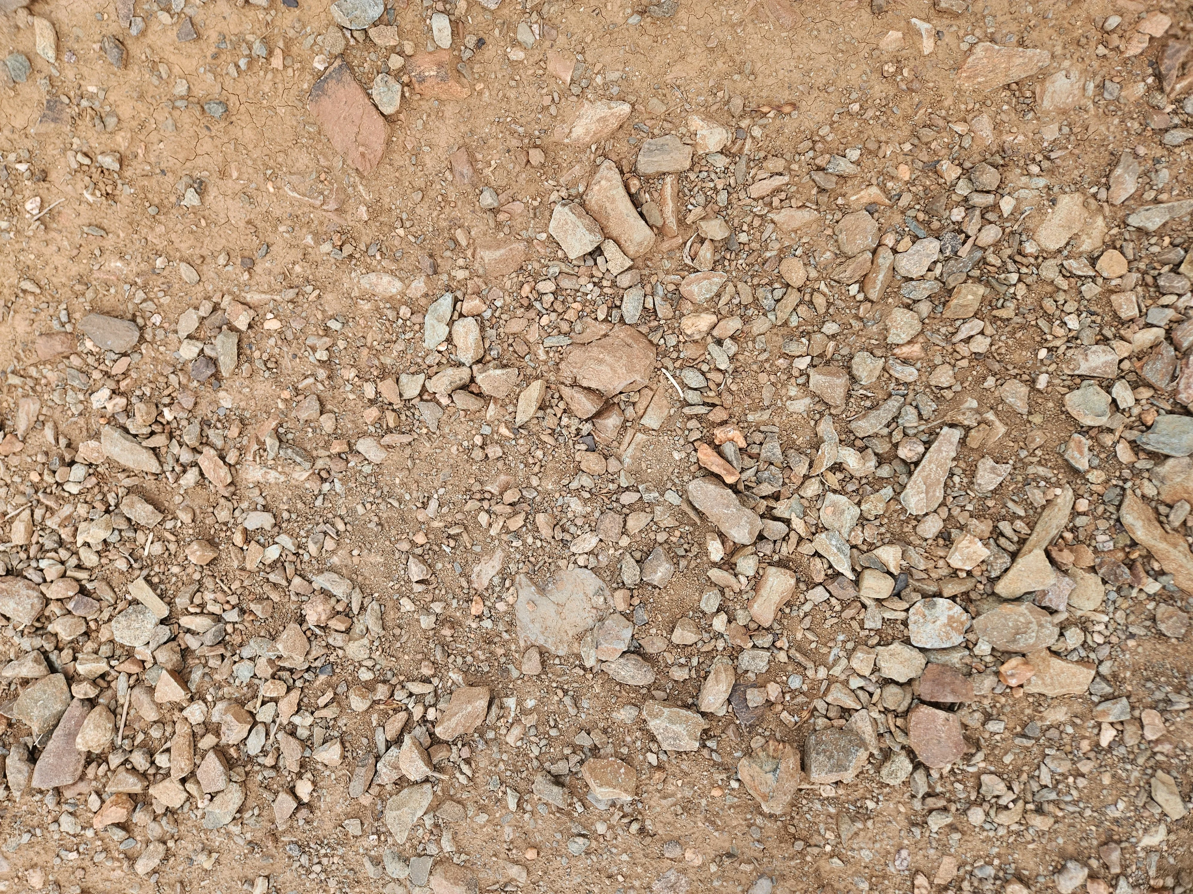 Desert floor, Anthem, Arizona - terracotta soil and desert stone